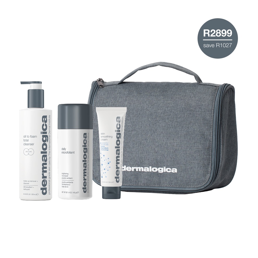 Dermalogica South Africa’s men’s daily face + body skin care kit includes three essentials: an oil to foam cleanser, a daily microfoliant exfoliant, and a moisturizer, all organized in a sleek gray travel bag. A circular label highlights the value: R2899 save R1027.