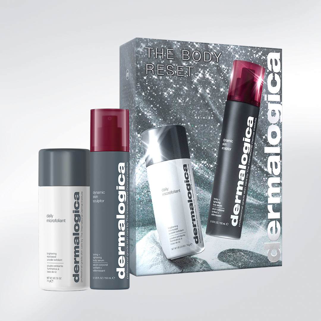 Two full-size bottles of daily microfoliant and two full-size bottles of dynamic skin sculptor, a firming serum, from the body reset set (2 full-size) by Dermalogica South Africa, standing in front of their gift box.