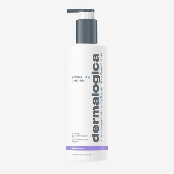 A 500 ml white pump bottle of Dermalogica ultracalming cleanser, with black and gray text, a purple accent near the base, and a gray dispenser. This non-foaming cleanser is ideal for sensitive skin.