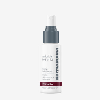 A white spray bottle of Dermalogica antioxidant hydramist, an antioxidant toner for firm, hydrated skin, with a gray pump and cap. 1.0 fl oz (30 ml), text emphasizes hydrating and firming benefits; shown on a white background.