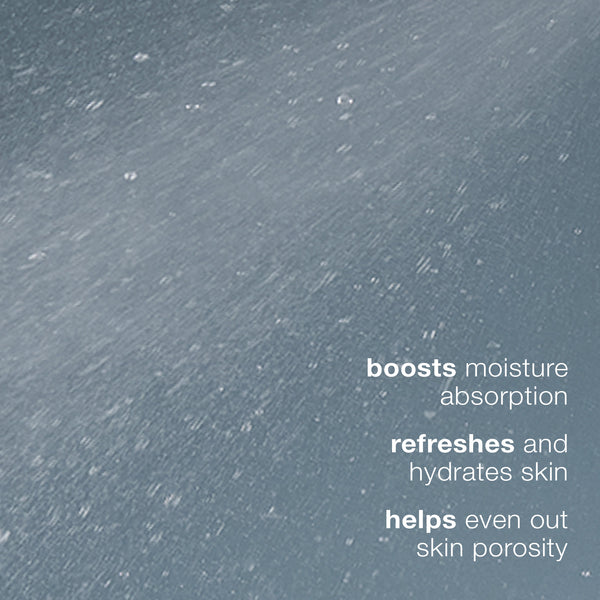 A mist of water sprays across a blue-gray background. White text on the right reads: Dermalogica multi active toner boosts moisture absorption, refreshes and hydrates skin, and evens out skin porosity as a facial toner.