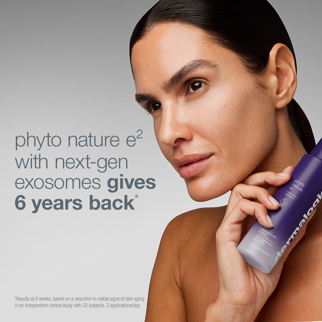 A woman holds a purple bottle of Phyto Nature serum from The expert lift set (3 full-size) next to text that reads, phyto nature e2 with next-gen exosomes gives 6 years back, a lift and firm solution.