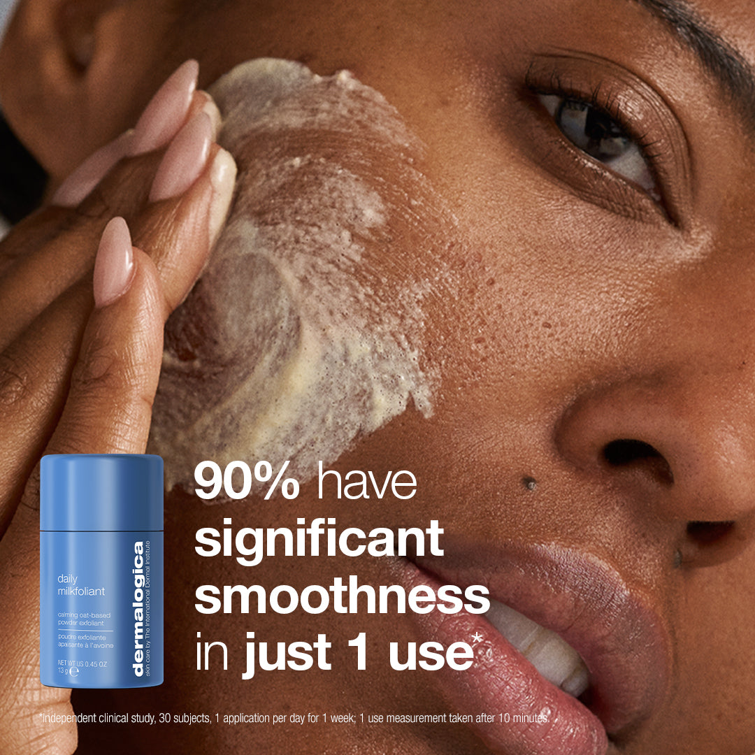 A person applies Stabilizing Repair Cream from the expert barrier repair set (3 travel-size) to their cheek next to a blue bottle of powder exfoliant, with text stating 90% have significant smoothness in just 1 use.
