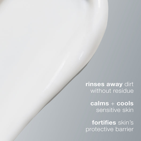 A smear of white cream on gray with text: Dermalogica ultracalming cleanser washes away dirt with no residue, soothes sensitive skin, and strengthens the protective barrier.