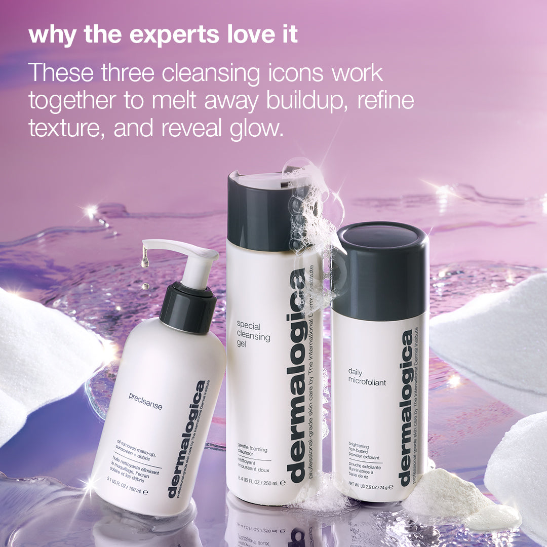 Dermalogica South Africa expert cleanse + glow set (3 full-size) arranged on a reflective surface with foam bubbles, featuring a pump bottle, two flip-top bottles, text on double cleansing, and a label highlighting the brightening powder exfoliant.