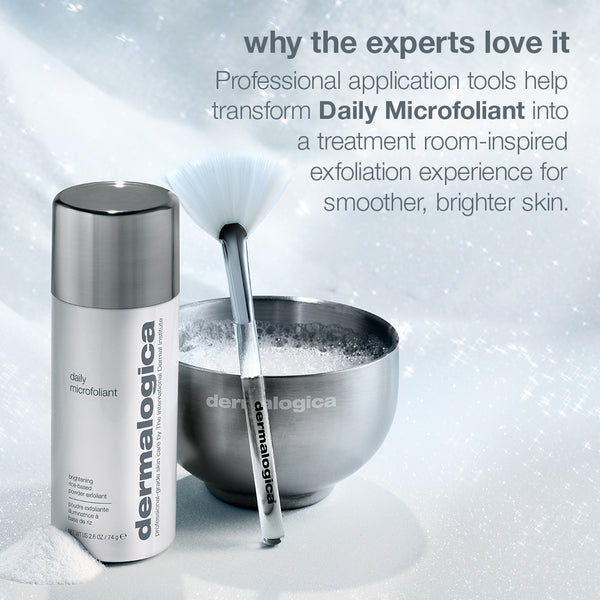 A bottle of Daily Microfoliant from the pro ritual: exfoliate + glow set (full-size + mixing bowl + fan brush), a fan brush, and a metal bowl of soapy water, with text explaining how to achieve a professional exfoliation experience.