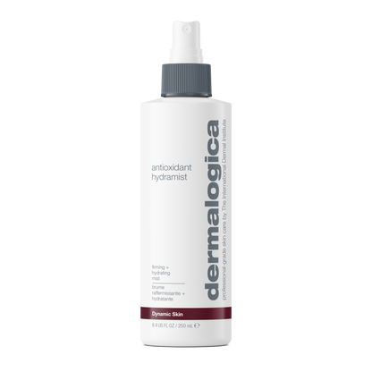 A white spray bottle of Dermalogica antioxidant hydramist with a gray cap and descriptive text highlights its firming and hydrating benefits—this antioxidant toner is formulated to hydrate, firm, and enhance skin radiance.
