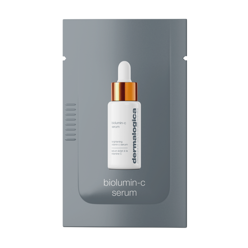 A grey sachet packet displays a white dropper bottle with an orange cap labeled "biolumin-c serum sample" by Dermalogica, with the product name shown below the bottle.