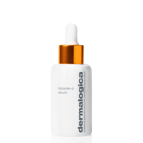 A white bottle of Dermalogica biolumin-c serum with a gold dropper cap and gray text is shown on a plain white background, emphasizing its minimalist design and anti-aging benefits.