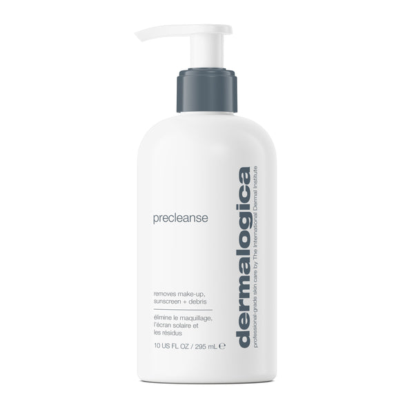 White bottle of Dermalogica precleanse deep-cleansing oil with a gray pump dispenser and printed text describing its use as a make-up and sunscreen remover.