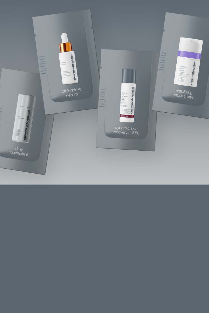 Five grey sample packets of Dermalogica skincare products are displayed, including daily superfoliant, biolumin-c serum, dynamic skin recovery SPF 50, and stabilizing repair cream, arranged against a grey background.