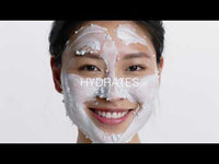 A tube of Dermalogica hydro masque exfoliant features blue gel with exfoliating bamboo beads, a gray and white cap, vertical Dermalogica branding, and hydrating benefits from snow mushroom extract.