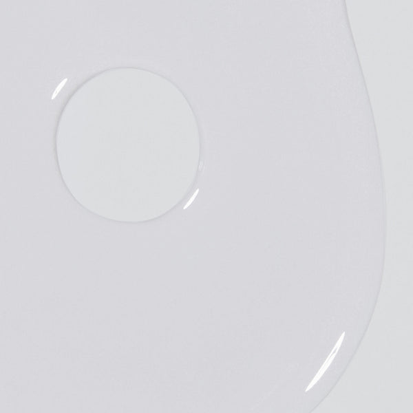 Close-up of Dermalogica rapid reveal peel, a translucent, glossy exfoliant liquid with a smooth texture and a circular bubble near the top left on a white background.